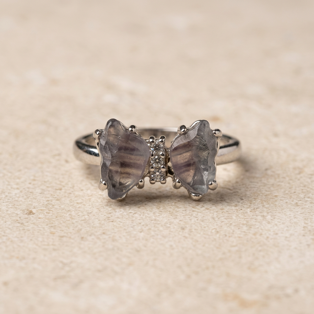 Farfalla in fluorite viola-grigio