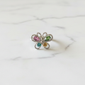 Anello farfalla tormalina flatlay marmo