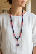 Mala collana indossata come collana lunga