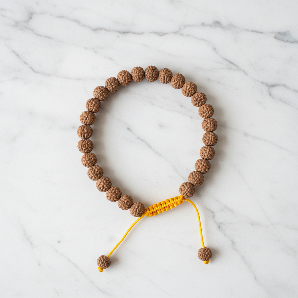 Bracciale rudraksha - variante filo giallo