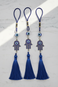 Pendenti mano di Fatima occhio nazar - flatlay marmo bianco
