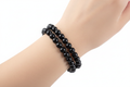 Bracciale ossidiana nera indossato al polso
