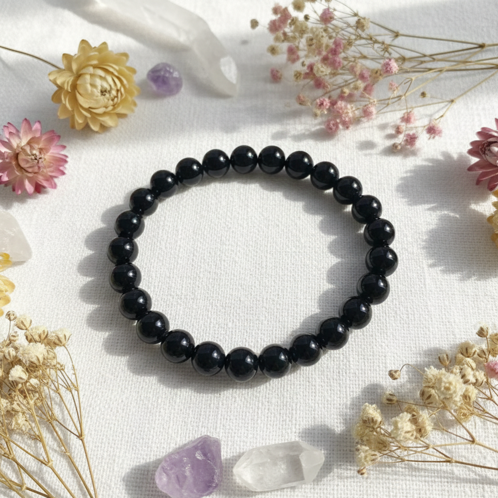 Bracciale ossidiana nera su lino con fiori e cristalli