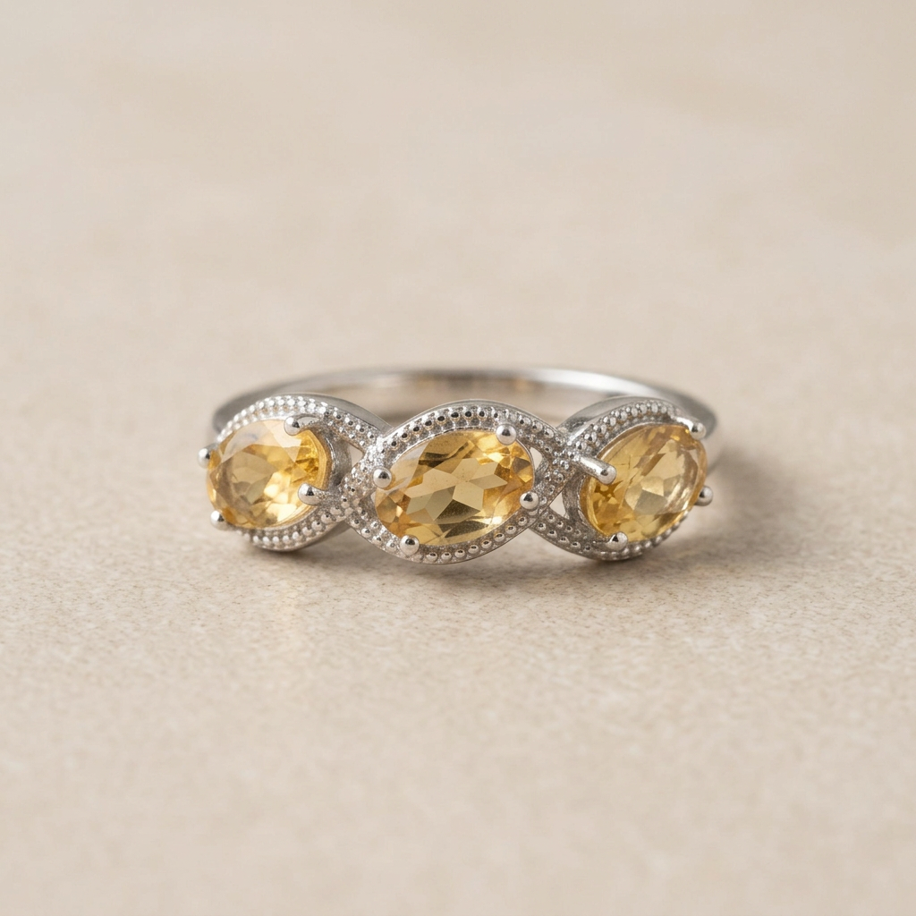 Anello 314 con tre citrini su pietra beige