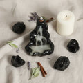 Bruciatore Cascata - flatlay lino con ossidiana e candela
